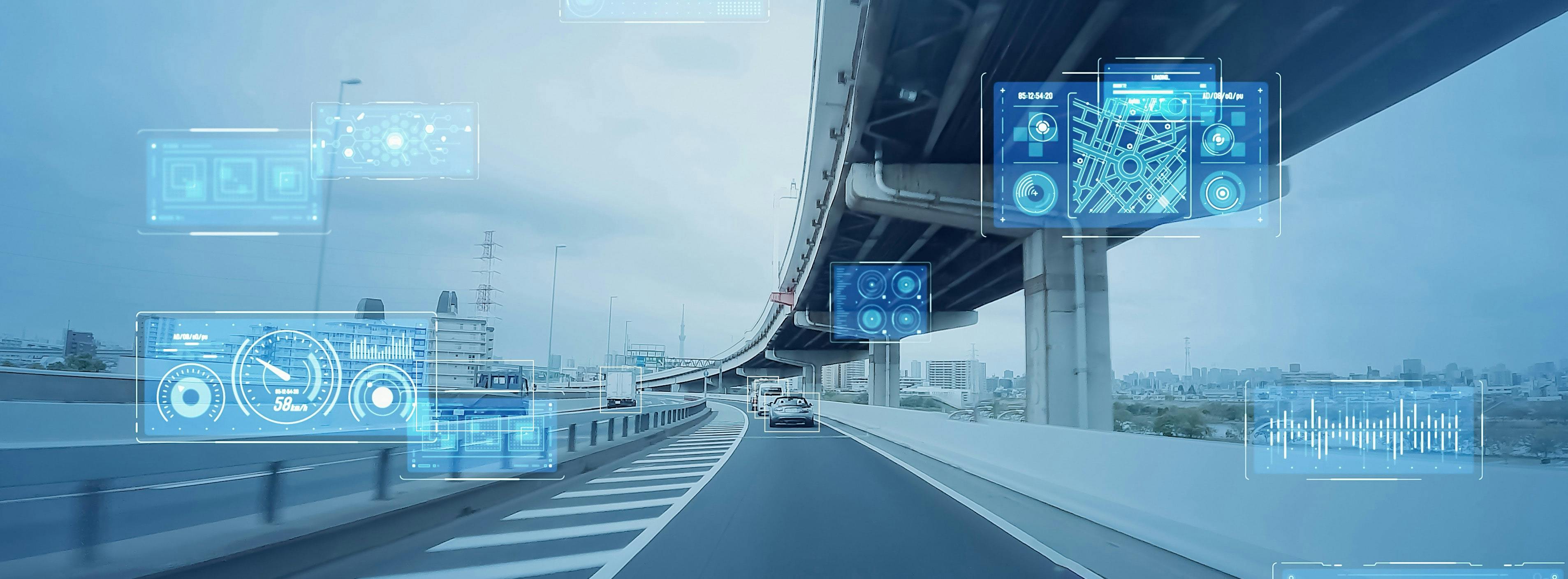View from autonomous car driving on highway with illustrated graphics of sensors and data